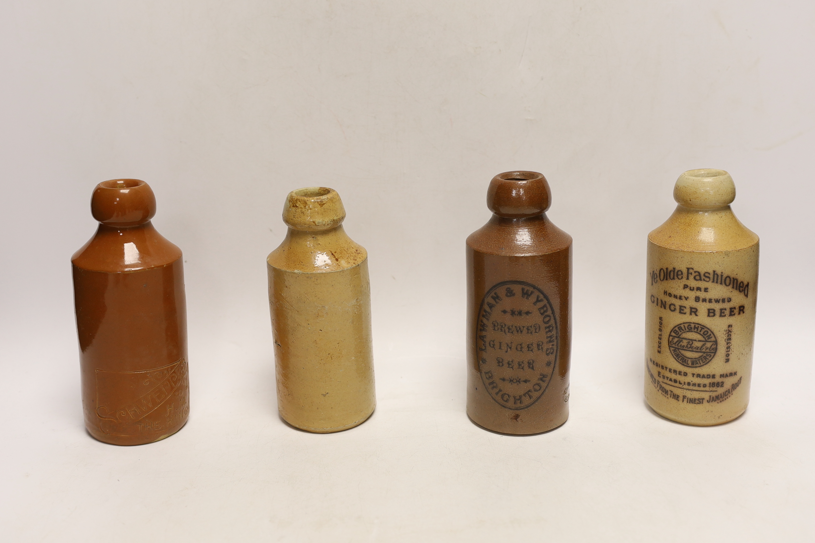 Early 20th century stoneware ginger beer bottles, two of Brighton, one of London, one of East Grinstead and four others